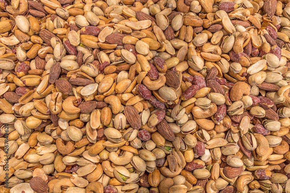 mix of roasted pistachio nuts cashew peanuts and almonds close up