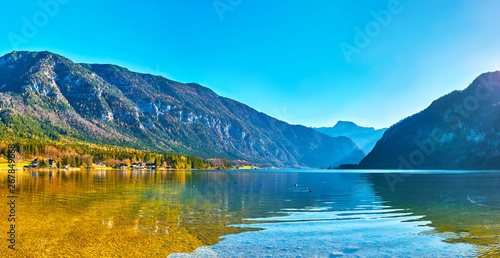 Hallstatt lake at sunny day, blue sky and mountain Sarstein. Late autumn, Salzkammergut region, Austria.