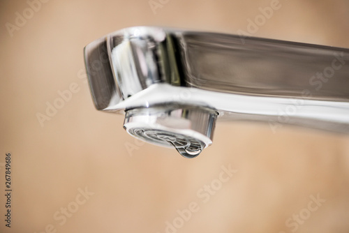 Water tap and drops of water. Water tap with dripping waterdrop. Water leaking, saving