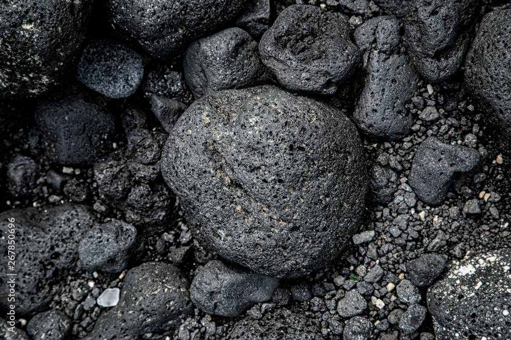 Volcano stones on the beach at pacific island Volcano stones on the beach at pacific island