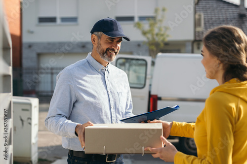 woman sending package over post express service