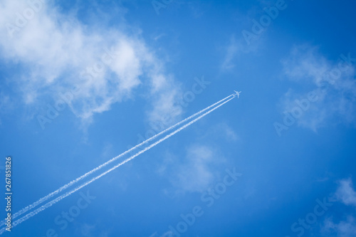 Trace of jet airplane in the sky with clouds