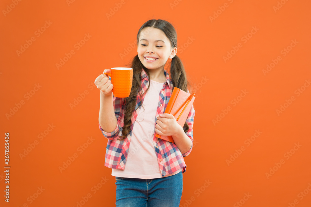 Reading bucket list. Spend nice time with favorite book. Girl hold cup of tea and book. Literature for kids. Enjoy spending time at home. Hot cocoa and good book perfect combination for cozy evening Reading bucket list. Spend nice time with favorite book. Girl hold cup of tea and book. Literature for kids. Enjoy spending time at home. Hot cocoa and good book perfect combination for cozy evening