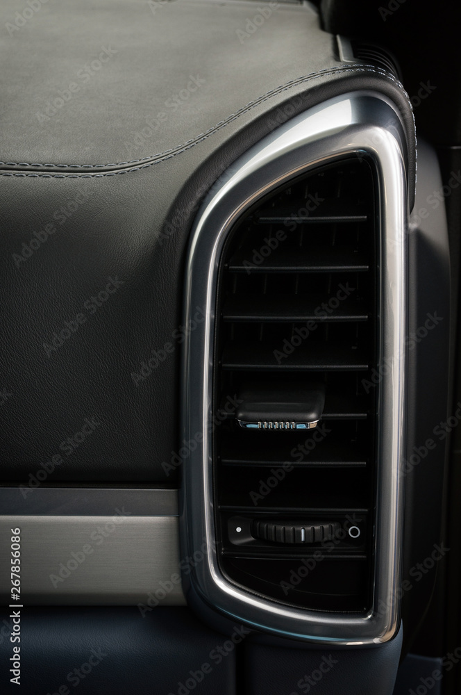 Air conditioning system on car dashboard.