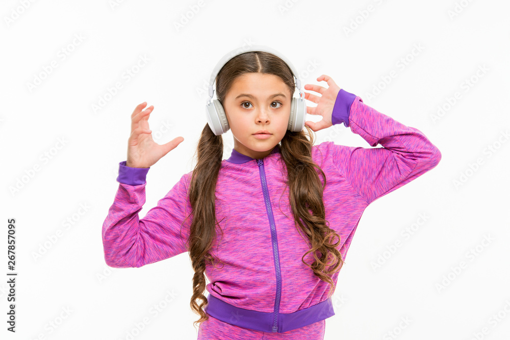 Time to rest. Active girl enjoy music playing in earphones. Athletic little girl relaxing isolated on white. Cute girl child listening to music. Fit small girl wearing headphones Time to rest. Active girl enjoy music playing in earphones. Athletic little girl relaxing isolated on white. Cute girl child listening to music. Fit small girl wearing headphones