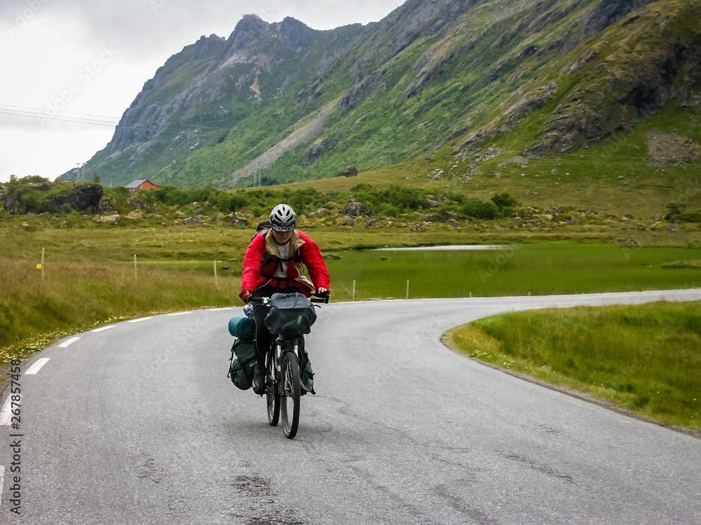 Cyclists travel in the mountains of Norway Cyclists travel in the mountains of Norway