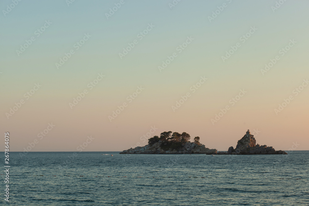 Sunset in City Petrovac, Montenegro. View on island in sea