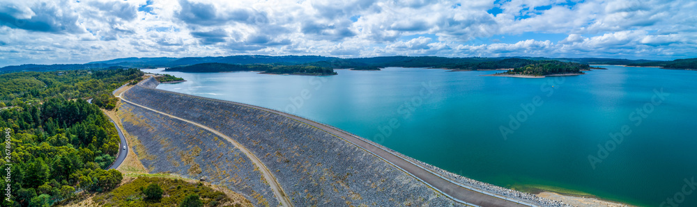 Obraz premium Scenic aerial panorama of Cardinia Reservoir lake and dam wall on overcast day