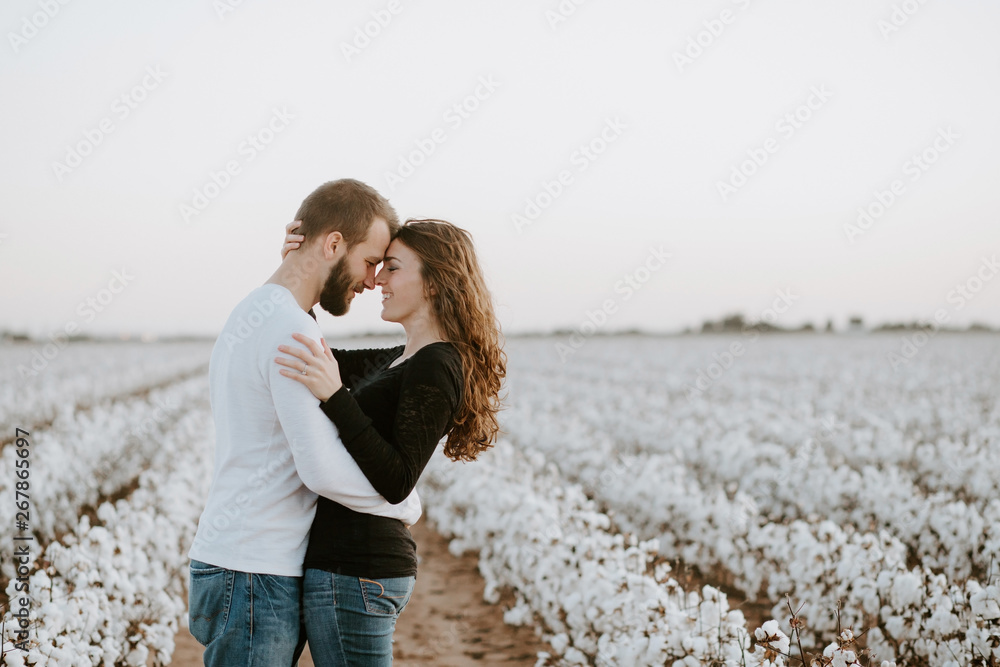 Happy Couple in a Cotton Field Stock Photo | Adobe Stock