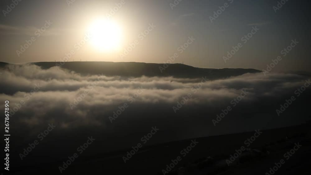 Nature timelapse of evening fog clouds move in mountain valley. Misty mountains at sunset Nature timelapse of evening fog clouds move in mountain valley. Misty mountains at sunset