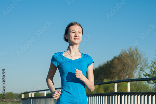 I always start a day for running.young slim girl goes in for sports in nature © HappyHaus