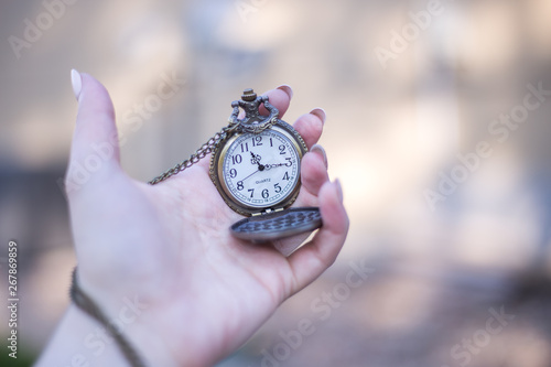 old pocket watch in a hand