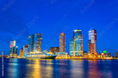 Night view of Holland america line building and other skyscrapers in Rotterdam, Netherlands photo