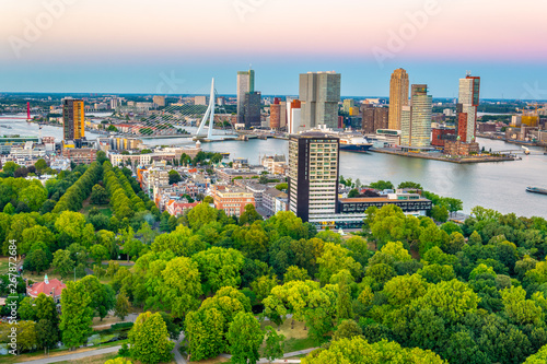 Sunset aerial view of Erasmus bridge and skyline of Rotterdam, Netherlands photo