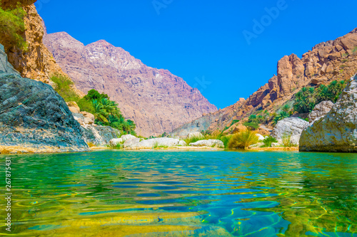 Lagoon with turqoise water in Wadi Tiwi in Oman.