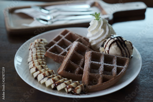 Homemade Belgian waffles with with bananas and ice cream