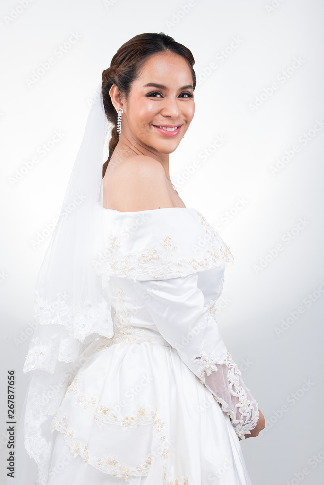 Lovely Asian Beautiful Woman bride in white wedding gown dress with lace veil, black hair, studio lighting white grey gradient background isolated copy space, sweet romantic soft alone bridal concept Lovely Asian Beautiful Woman bride in white wedding gown dress with lace veil, black hair, studio lighting white grey gradient background isolated copy space, sweet romantic soft alone bridal concept