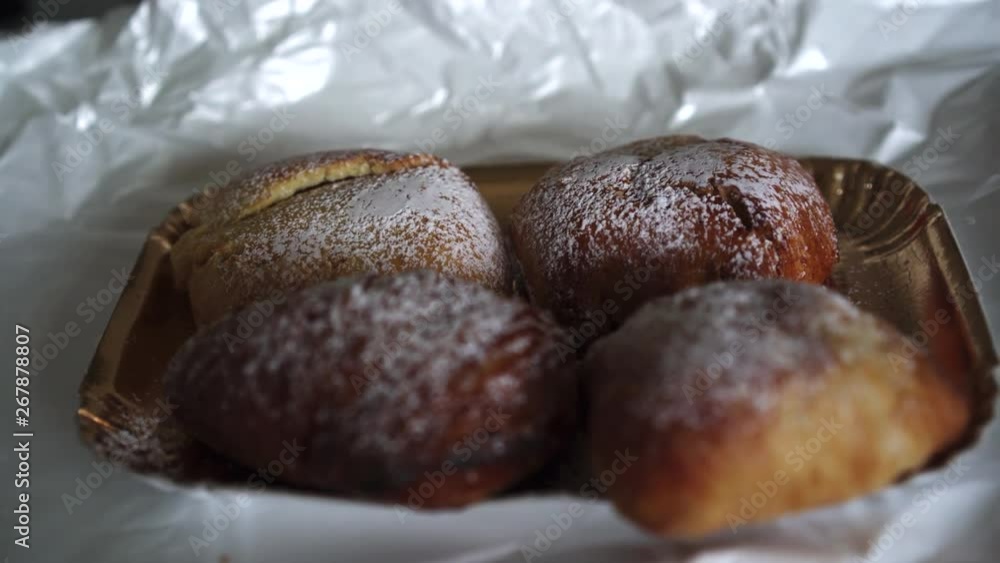 Close up hand of woman with age spots picking up a traditional famous italian neapolitan pastry called sfogliatella napoletana 4k Close up hand of woman with age spots picking up a traditional famous italian neapolitan pastry called sfogliatella napoletana 4k