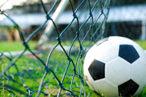 Soccer ball in green field, Soccer ball on grass, vintage style,copy space © mrspopman