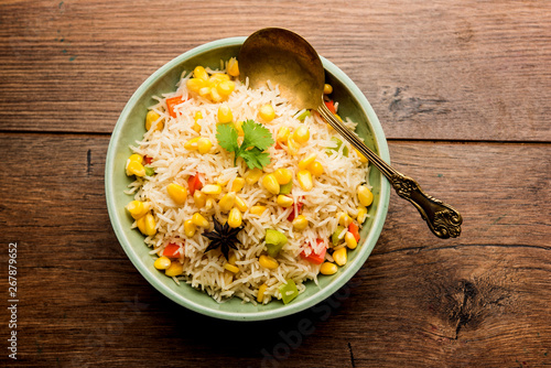 Corn Rice made using boiled Maize seeds with basmati rice, served in a bowl. selective focus 