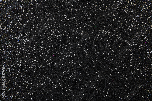 Black foam surface with glitter.