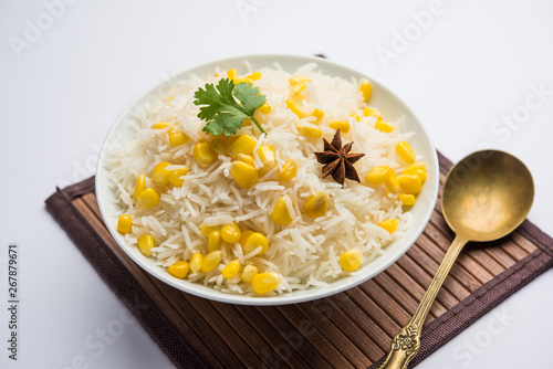 Corn Rice made using boiled Maize seeds with basmati rice, served in a bowl. selective focus 