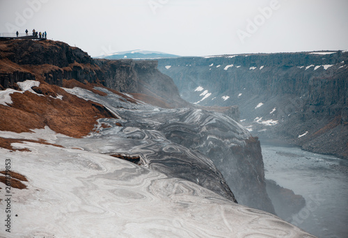 Textured ice piled up from the spray of Dettifoss waterfall in Iceland