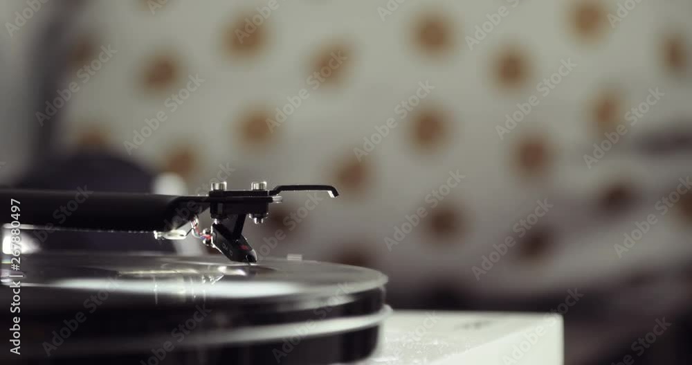 Turntable vinyl record player on blur background in the old interior
