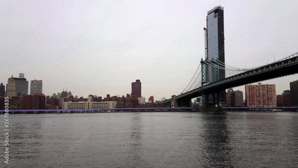 View of Manhattan bridge over east river with traffic in the distance 4k View of Manhattan bridge over east river with traffic in the distance 4k