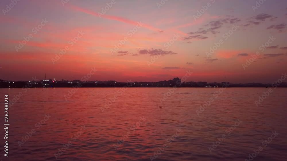A Colorful Scenic View of Lake in the City During Sunset. A Colorful Scenic View of Lake in the City During Sunset.