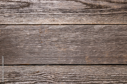 Faded wood grain background.