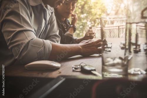Man colleagues meeting in coffee shop shared wireless mobile while chat message from social network