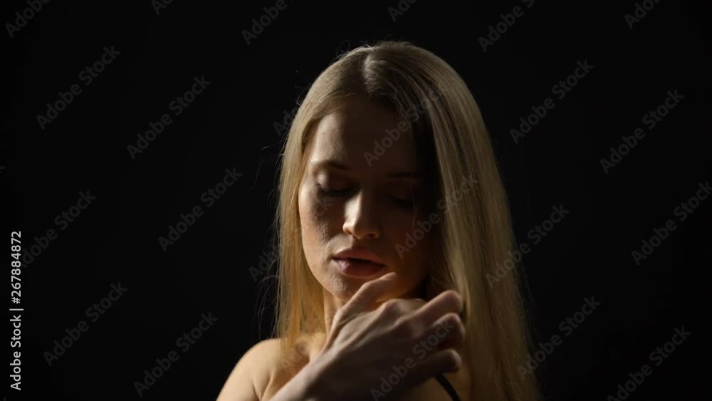 Confident woman taking off clothes in front of camera, seduction, escort service Confident woman taking off clothes in front of camera, seduction, escort service