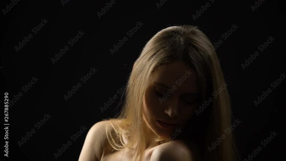 Seductive lady stroking body and taking off clothes, smiling at camera, escort Seductive lady stroking body and taking off clothes, smiling at camera, escort