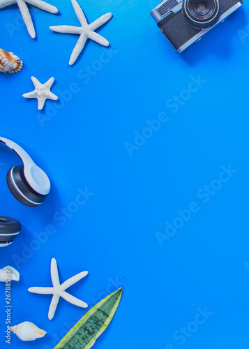 summer traveler beach accessories on blue background