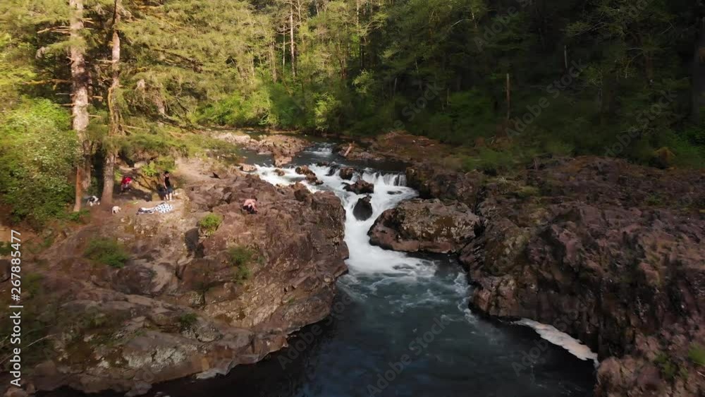 Aerial Drone of river with waterfall through forest canyon people and tourists on ledge in summer Moulton Falls, Washington, 4k Aerial Drone of river with waterfall through forest canyon people and tourists on ledge in summer Moulton Falls, Washington, 4k
