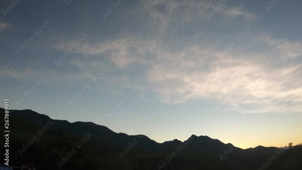 4k Timelapse of a sunrise, sunset and moving clouds over a mountain backdrop that makes for a majestic landscape. 4k Timelapse of a sunrise, sunset and moving clouds over a mountain backdrop that makes for a majestic landscape.