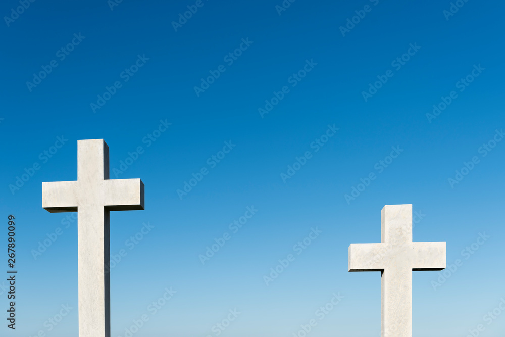 two crosses with blue sky background