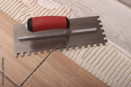 Tile setting with a trowel