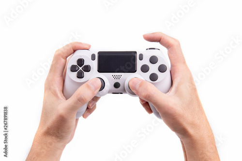 Joystick gaming controller in hand isolated on white background , Video game console developed Interactive Entertainment