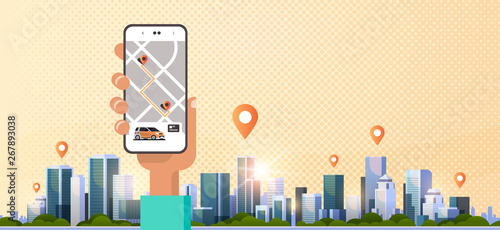 human hand using online ordering taxi car sharing mobile application concept transportation carsharing service app smartphone screen with gps map modern cityscape background horizontal