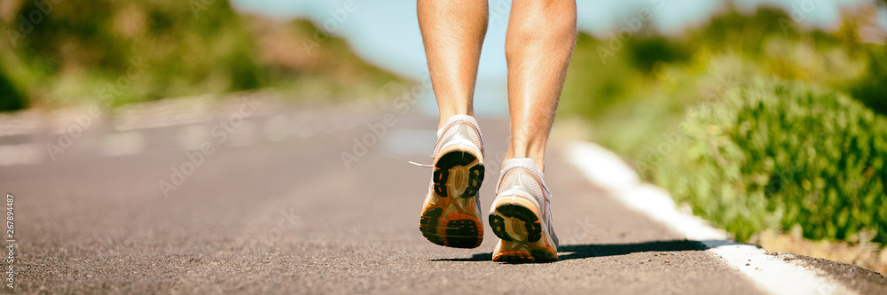 Fit run runner man jogging feet closeup running shoes banner panorama.  Athletes legs walking on street for summer marathon. Stock Photo | Adobe  Stock
