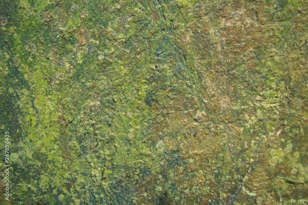 Background and black marble. Bedrock Stone In the forest near the waterfall Background and black marble. Bedrock Stone In the forest near the waterfall