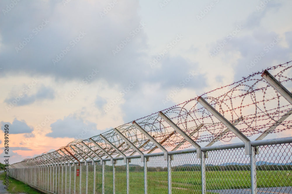 wire mesh steel with green grass background in Phuket Thailand