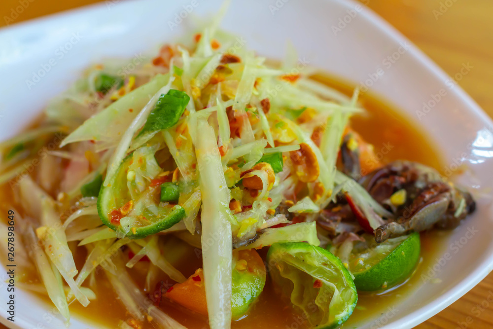 Green papaya salad Thai cuisine spicy delicious. Thai call som tam