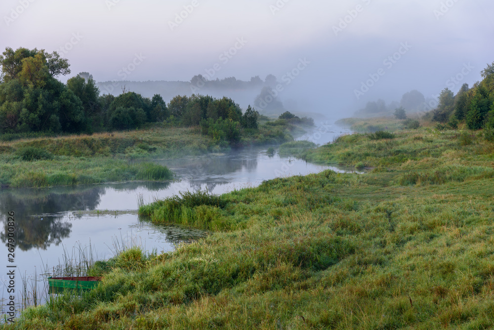 Morning landscape on a foggy river. Russia
