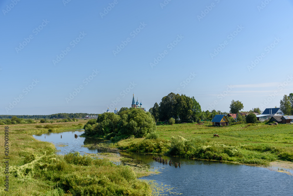 Village on the banks of the river, Russia