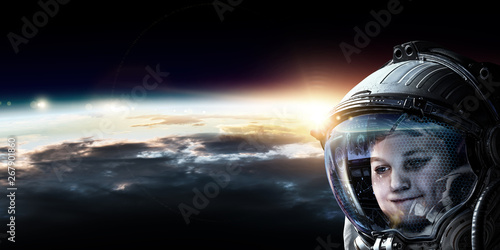 Little astronaut on planet orbit © Sergey Nivens