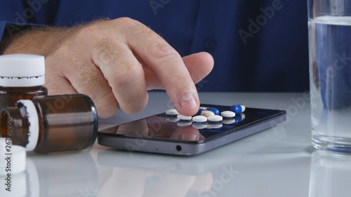 Man Choose and Take Medical Pills for Headache from Cellphone Screen Surface