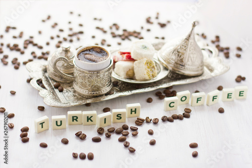 Traditional Turkish coffee and sweets in silverware. Lettering Turkish coffee
